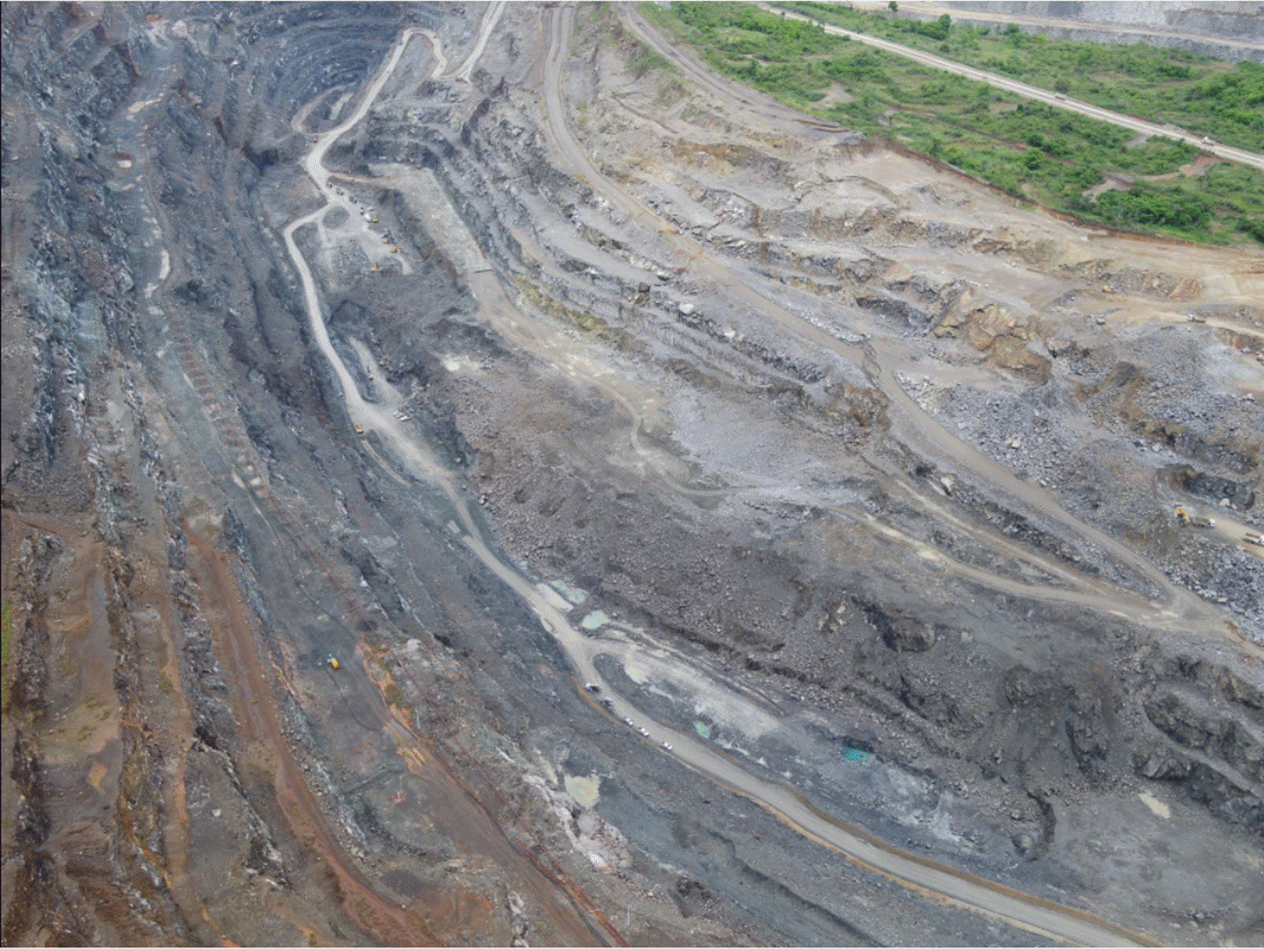 A aerial view of a quarry

Description automatically generated